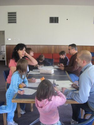 The Rakos family making scrapbooks