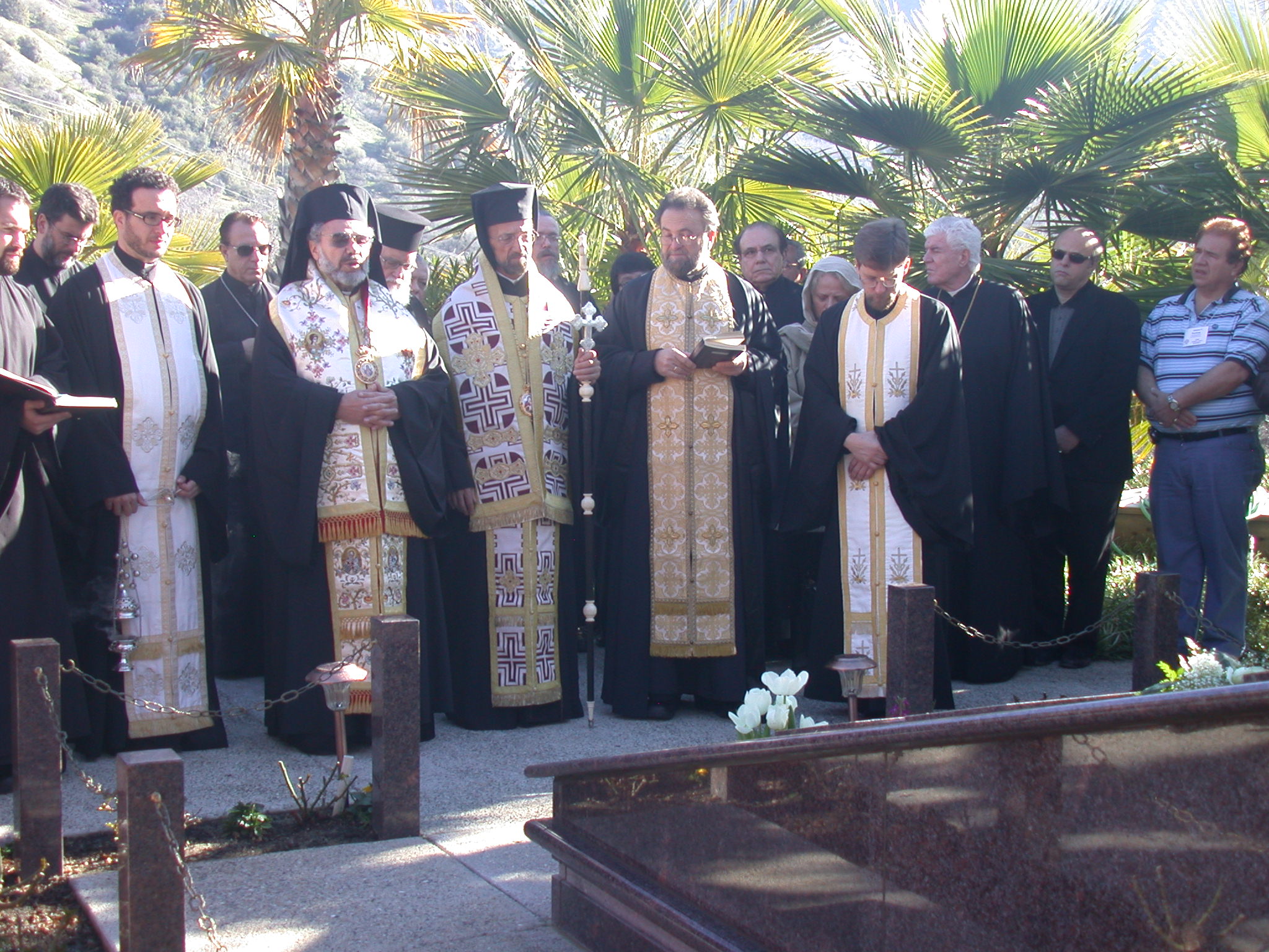 2.	Metropolitan Gerasimos (center) leads a graveside Trisagion prayer service for +Metropolitan Anthony, of blessed memory.  (L-R) Father Christopher Flesoras (St. Anna – Roseville, CA), His Grace Bishop Anthimos of Olympos, Metropolitan Gerasimos, Father John Bakas (St. Sophia Cathedral – Los Angeles, CA), Father Paul Schroeder (Holy Trinity Cathedral – Portland, OR).